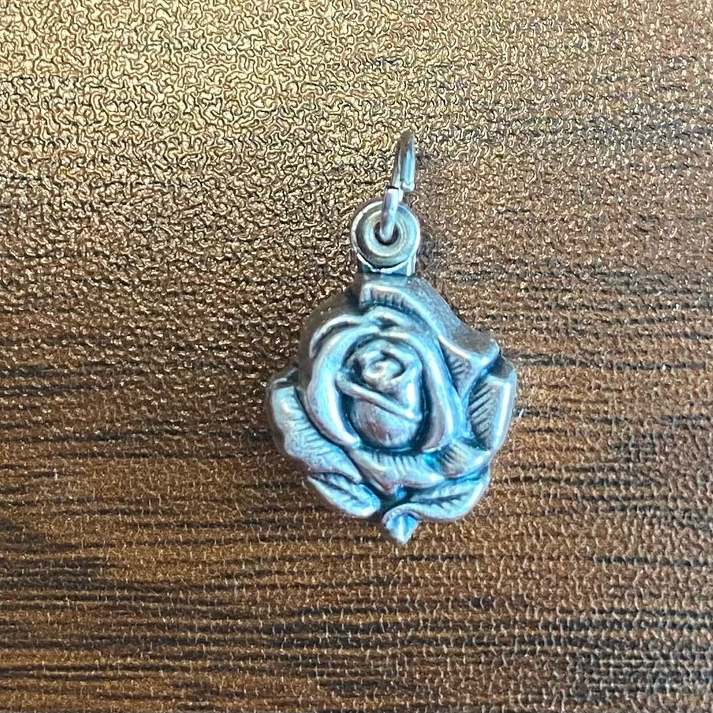 Rose with a locket with Mary Madonna